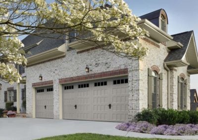 Garage door with recessed panels