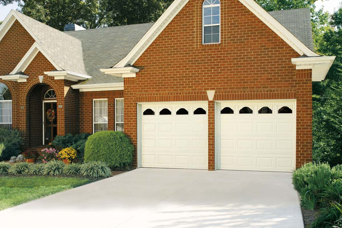 Brick house with vinyl garage doors